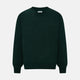 The Turnbull & Asser Forest Green Fine Merino V-Neck Jumper features long sleeves, ribbed cuffs and hem—classic knitwear for any wardrobe, shown on a white background.