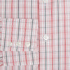 View 4 of product The Turnbull & Asser Red Multi Check Mayfair Shirt is a long-sleeve, button-up with a collar, crafted from Italian cotton and featuring a red multi check plaid pattern on white, shown laid flat against a white surface.