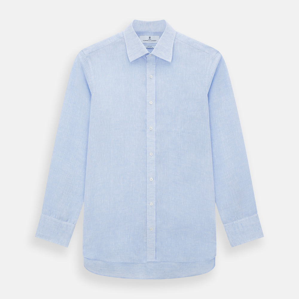 The Turnbull & Asser Pale Blue Linen Mayfair Shirt features a collar, front pocket, and white buttons. This long-sleeve shirt is displayed on a white background.
