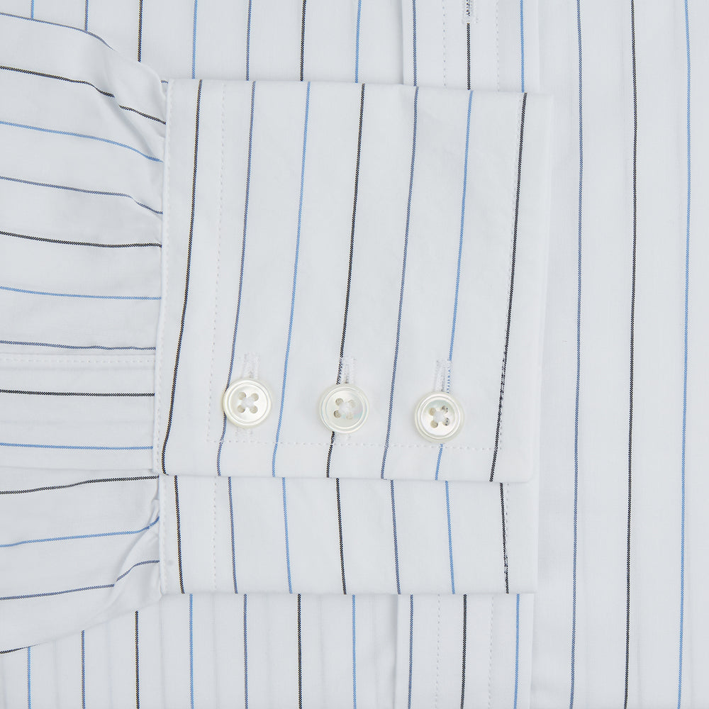 The Blue Wide Pinstripe Mayfair Shirt by Turnbull & Asser is a contemporary long-sleeve button-down with a collar, crafted from white fabric with bold vertical blue pinstripes. It is displayed neatly on a plain white background.