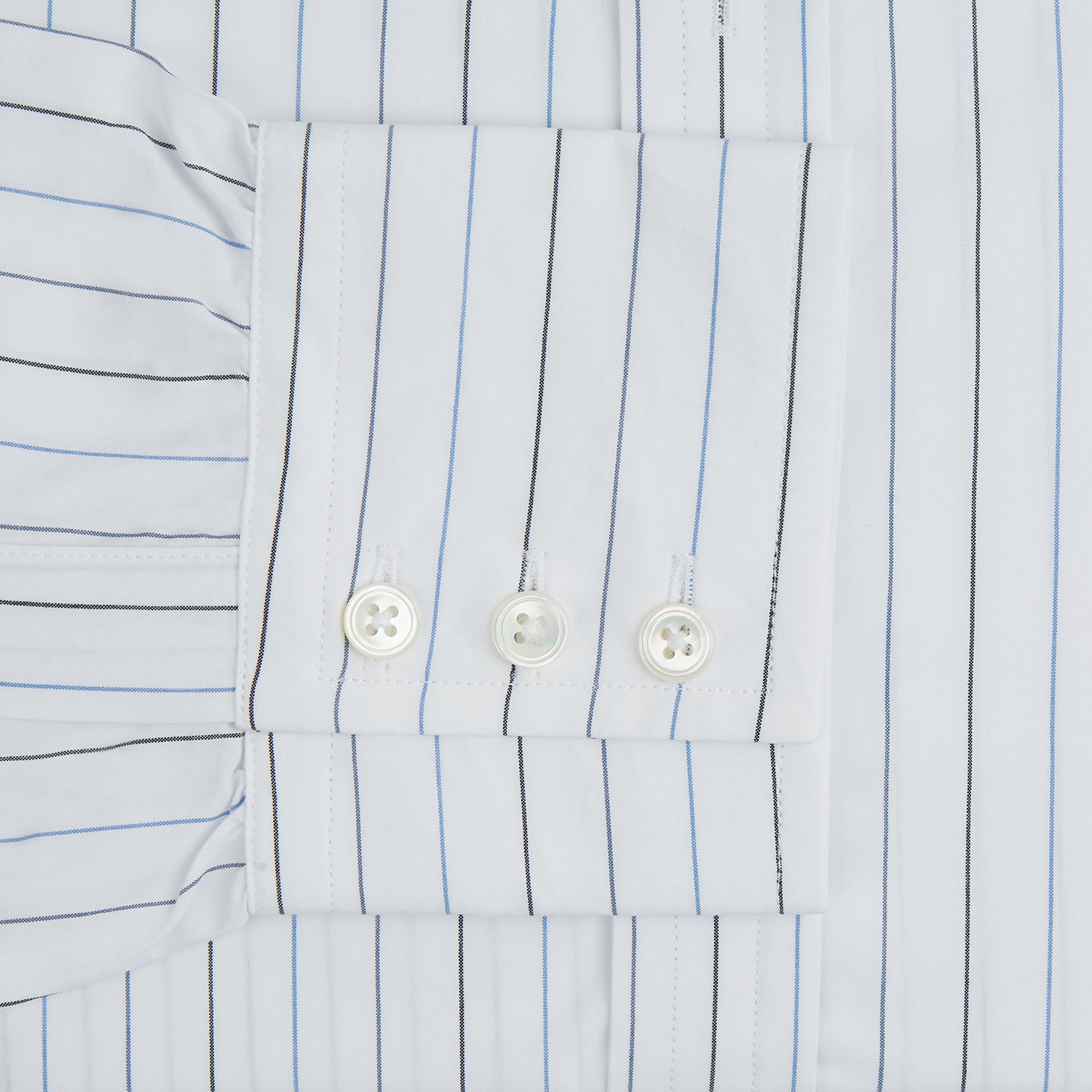 View 4 of product The Blue Wide Pinstripe Mayfair Shirt by Turnbull & Asser is a contemporary long-sleeve button-down with a collar, crafted from white fabric with bold vertical blue pinstripes. It is displayed neatly on a plain white background.