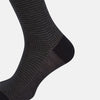 View 4 of product The Turnbull & Asser Charcoal Melange Houndstooth Mid-Length Sock features a black toe, heel, and cuff, and is shown singly against a plain white background.