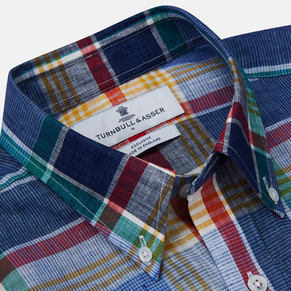 The Blue Multi Check Linen Weekend Fit Suffolk Shirt by Turnbull & Asser features a classic collar, white buttons, chest pocket, and colorful blue, green, yellow, red, and white plaid—perfect for a casual weekend look.