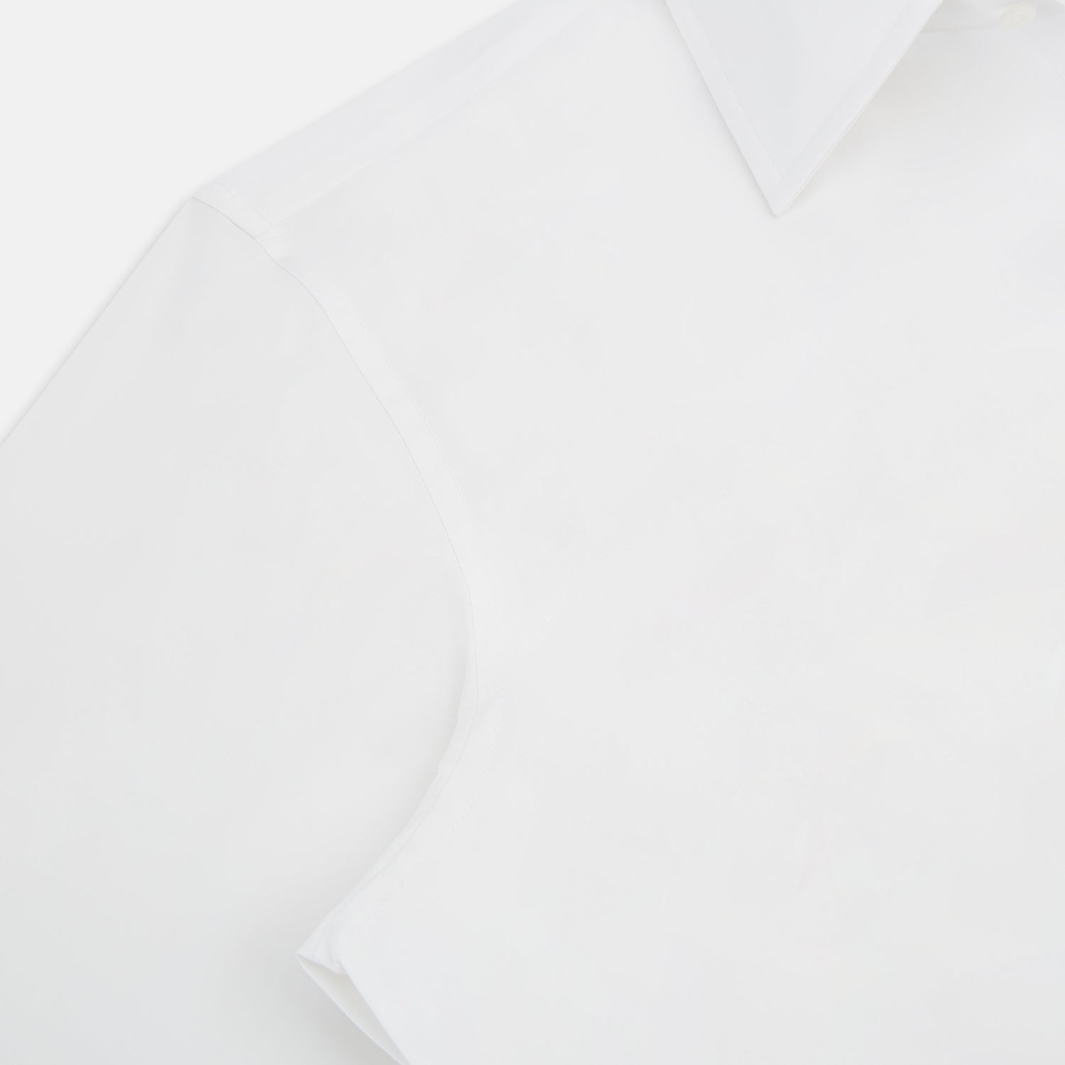 View 6 of product The Turnbull & Asser White Westminster Shirt is a long-sleeve, button-up dress shirt with a classic cut and Westminster collar, shown on a white background.