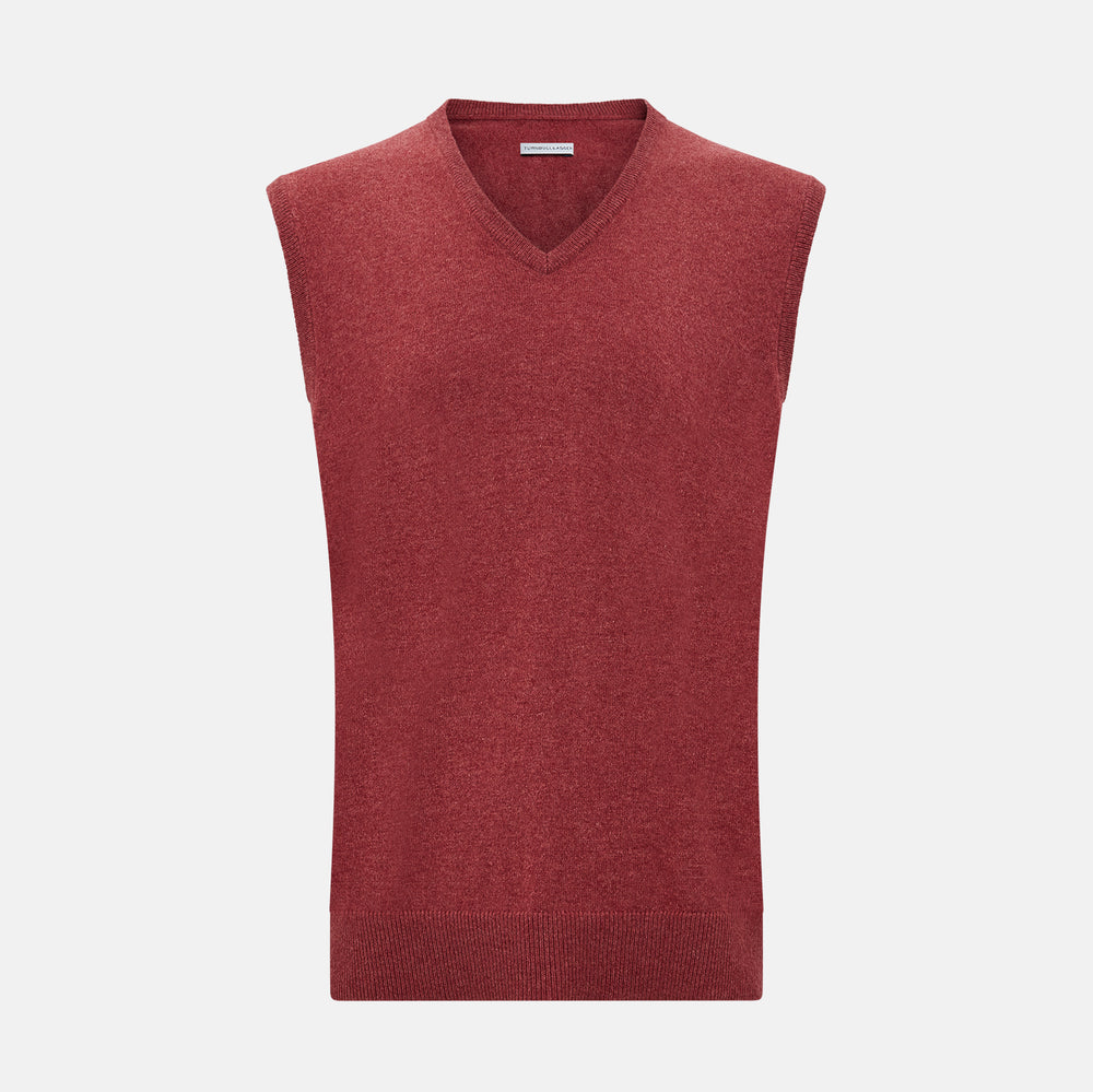 A refined piece from Turnbull & Asser, the Antique Pink Cashmere V-Neck Vest features a sleeveless design with a ribbed hem, shown against a plain white background.