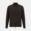 View 1 of product The Brown Merino High Neck Zipped Cardigan by Turnbull & Asser features long sleeves, ribbed cuffs and hem, and is shown on a white background as part of our knitwear collection.