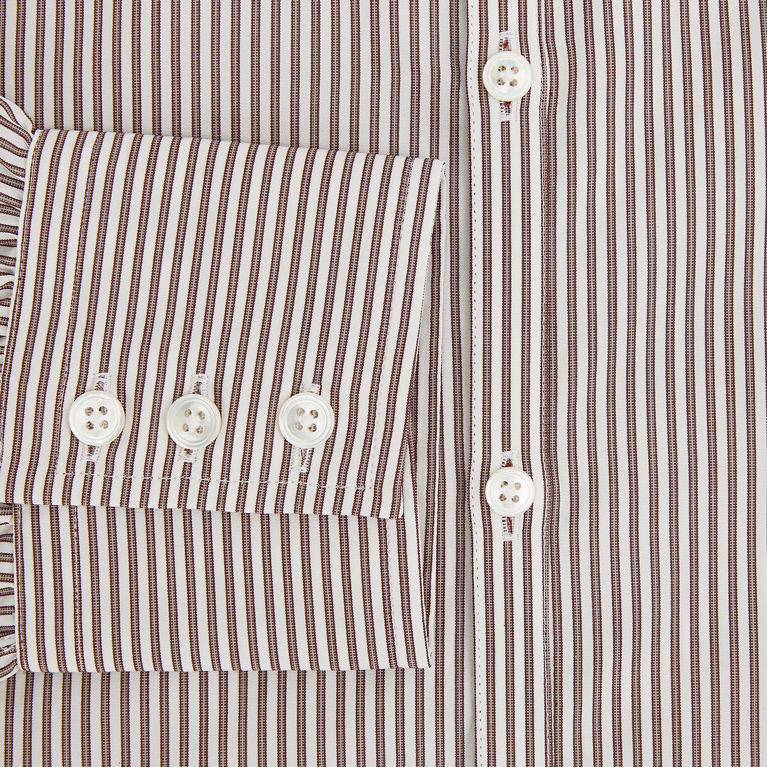 View 4 of product The Burgundy Halo Stripe Westminster Shirt by Turnbull & Asser features long sleeves, a button-up front, a Westminster collar, and thin vertical brown and white stripes, shown on a plain white background.