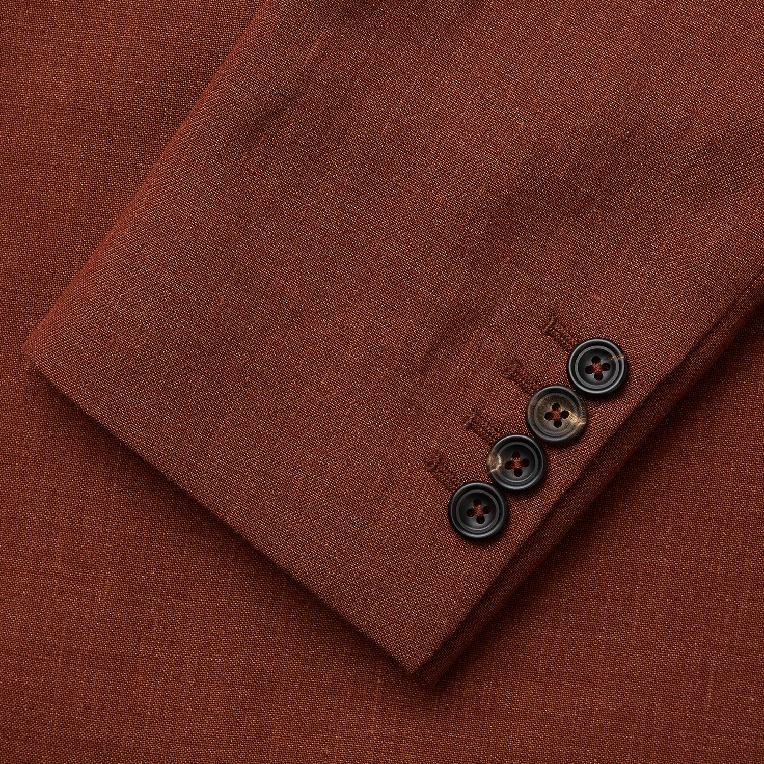 View 6 of product The Turnbull & Asser Rust Linen-Wool-Silk Bertie Blazer is a red double-breasted jacket with peak lapels, black buttons, and flap pockets, tailored in Italy from a luxury linen-wool-silk blend and shown on a white background.