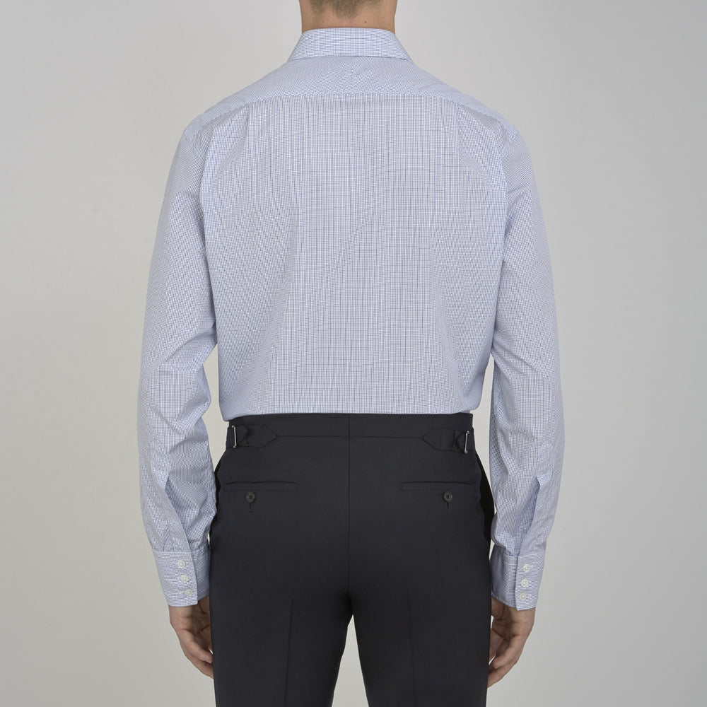 A neatly folded Turnbull & Asser Blue Grid Check Shirt features a T&A collar, 3-button cuffs, white buttons, and subtle British style. The blue and white check cotton design displays the brand label inside the collar.