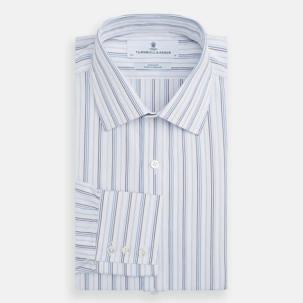 The Turnbull & Asser Blue Fine Multi Pinstripe Mayfair Shirt features long sleeves, an organic cotton build, a T&A collar, and vertical blue stripes. Laid neatly on a white background.