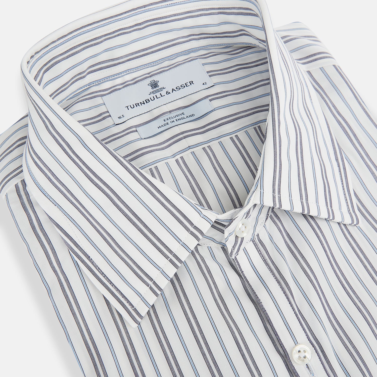 View 2 of product The Turnbull & Asser Navy and Light Blue Multi Track Stripe Westminster Shirt, featuring a button-up design with long sleeves and a signature collar, is displayed flat to highlight its expert British craftsmanship.