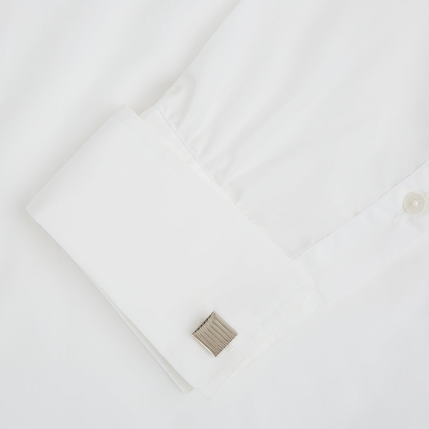 View 3 of product Turnbull & Asser Silver Striped Square Cufflinks feature a ridged, horizontal line design on sterling silver, set against a white background.