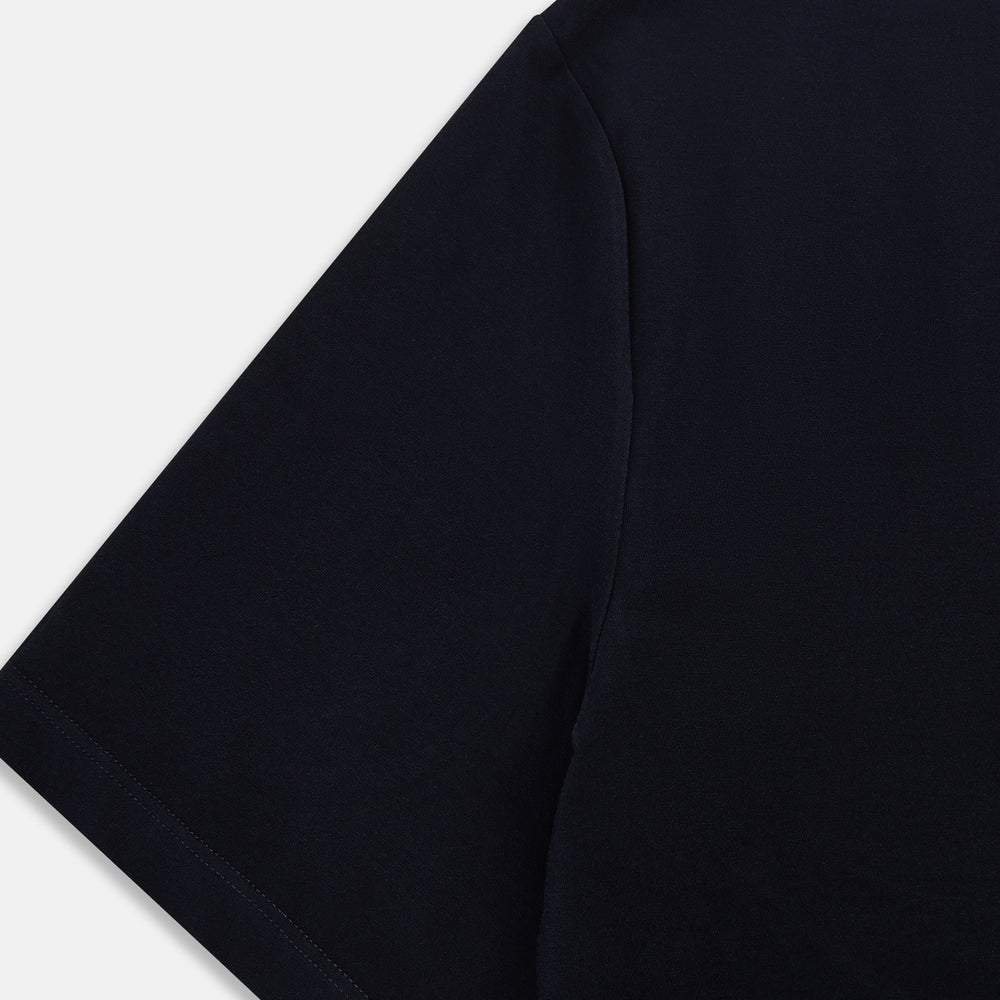 A navy short-sleeve pyjama shirt by Turnbull & Asser is laid flat on a white background, displaying the front view. Its soft fabric ensures comfort with no visible logos, designs, or patterns on the shirt.