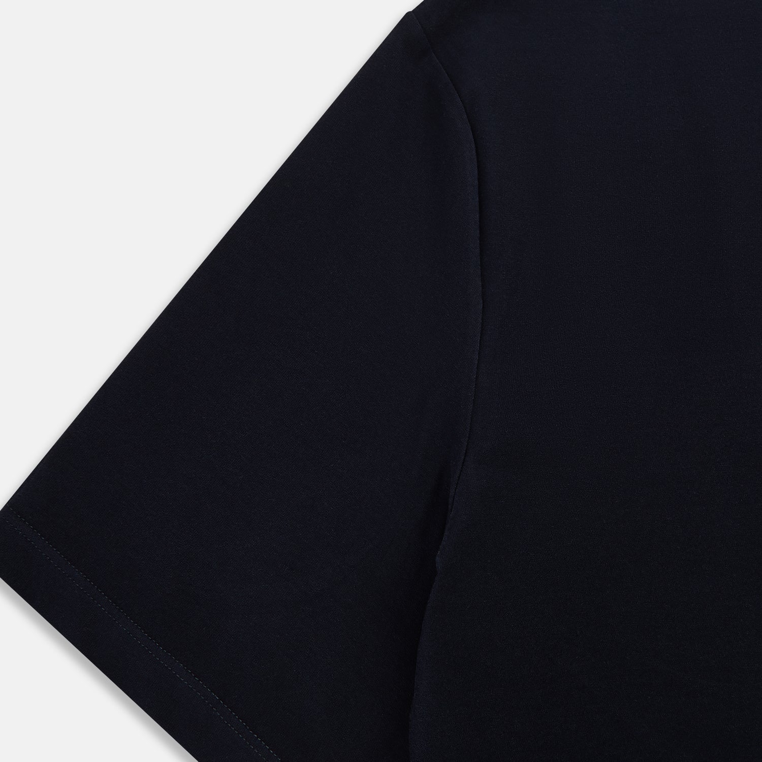 View 4 of product A navy short-sleeve pyjama shirt by Turnbull & Asser is laid flat on a white background, displaying the front view. Its soft fabric ensures comfort with no visible logos, designs, or patterns on the shirt.