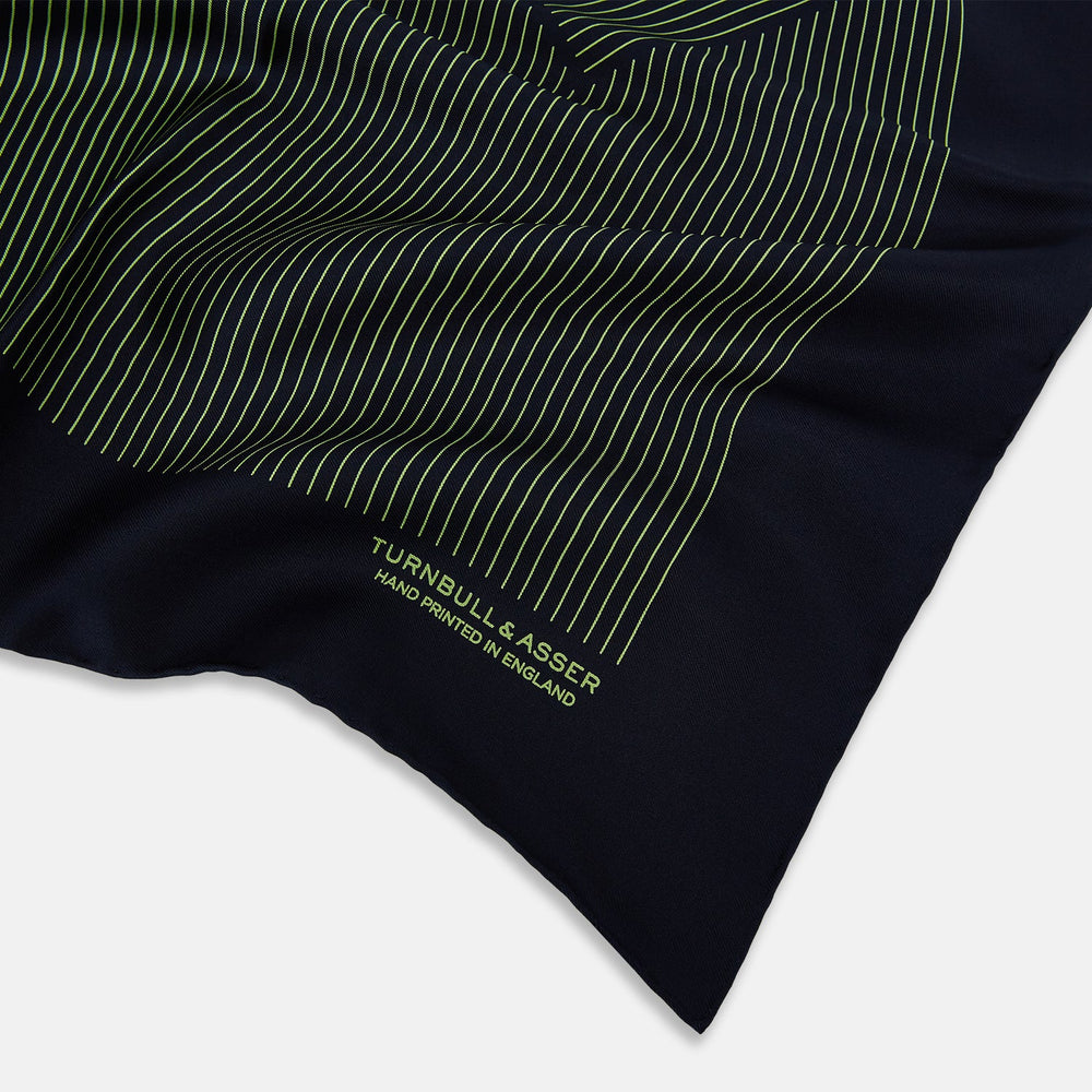 The Navy and Melon Green Stripe Silk Pocket Square by Turnbull & Asser features refined stripes, hand-printed branding in the corner, and is finished with elegant hand-rolled edges.