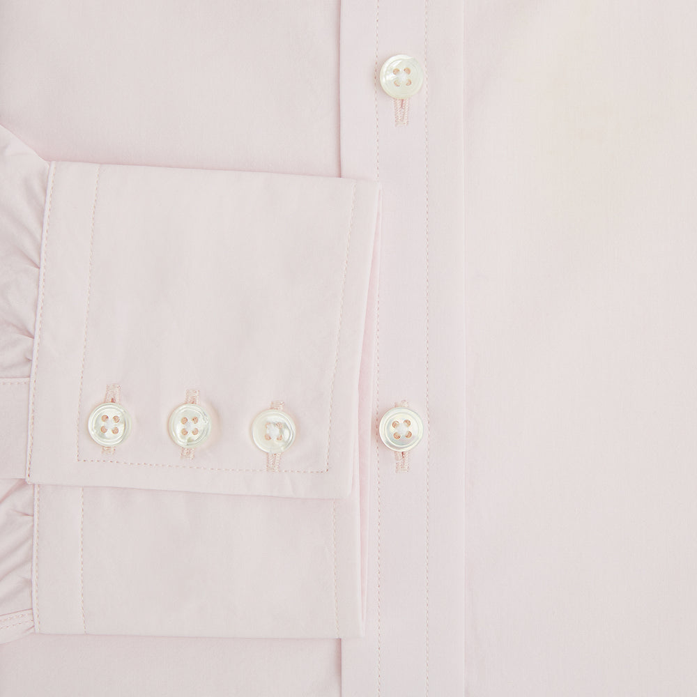 The Soft Pink Mayfair Shirt by Turnbull & Asser is a long-sleeved, sanforised cotton button-up with a classic collar, white buttons, and buttoned cuffs, shown against a plain white background.
