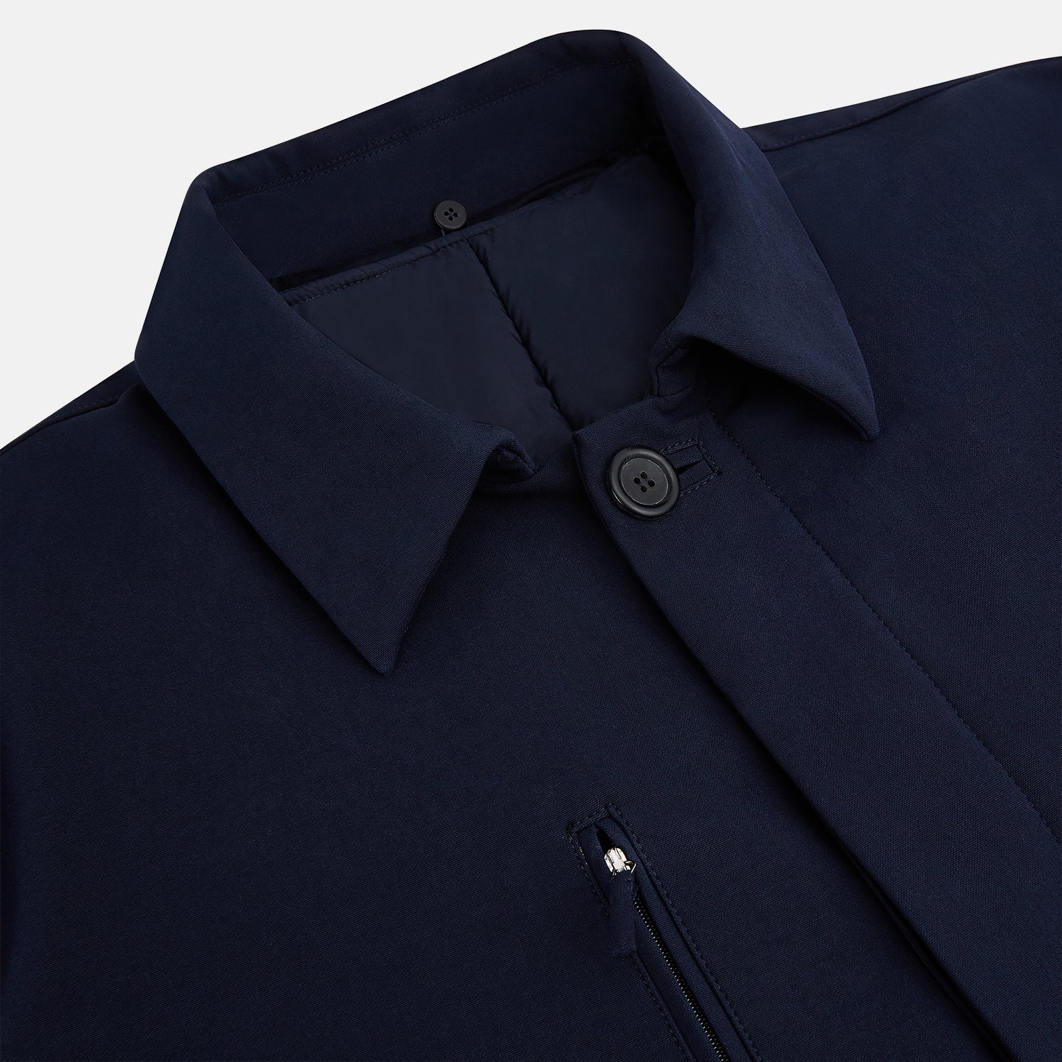 View 2 of product A Navy John Arthur Trench Coat by Turnbull & Asser, featuring a collar, button closure, adjustable cuff straps, two slanted front pockets, and a chest zip pocket, is displayed flat on a white background.