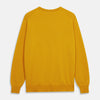 View 3 of product The Gold Glenn Cashmere Crew Neck Jumper by Turnbull & Asser is a luxurious, long-sleeved knit in vibrant mustard yellow, shown laid flat on a white background—an eye-catching essential.
