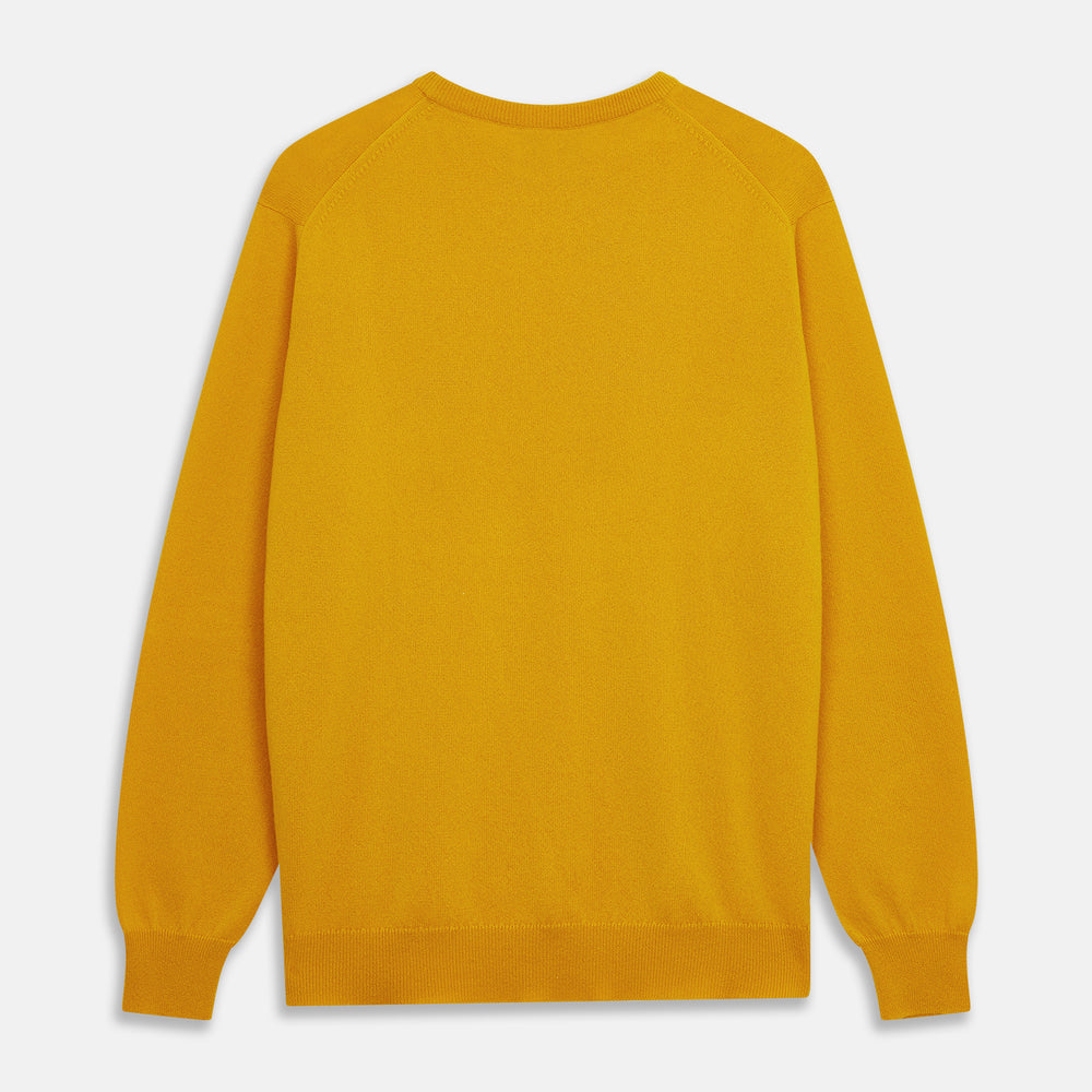 The Gold Glenn Cashmere Crew Neck Jumper by Turnbull & Asser is a luxurious, long-sleeved knit in vibrant mustard yellow, shown laid flat on a white background—an eye-catching essential.