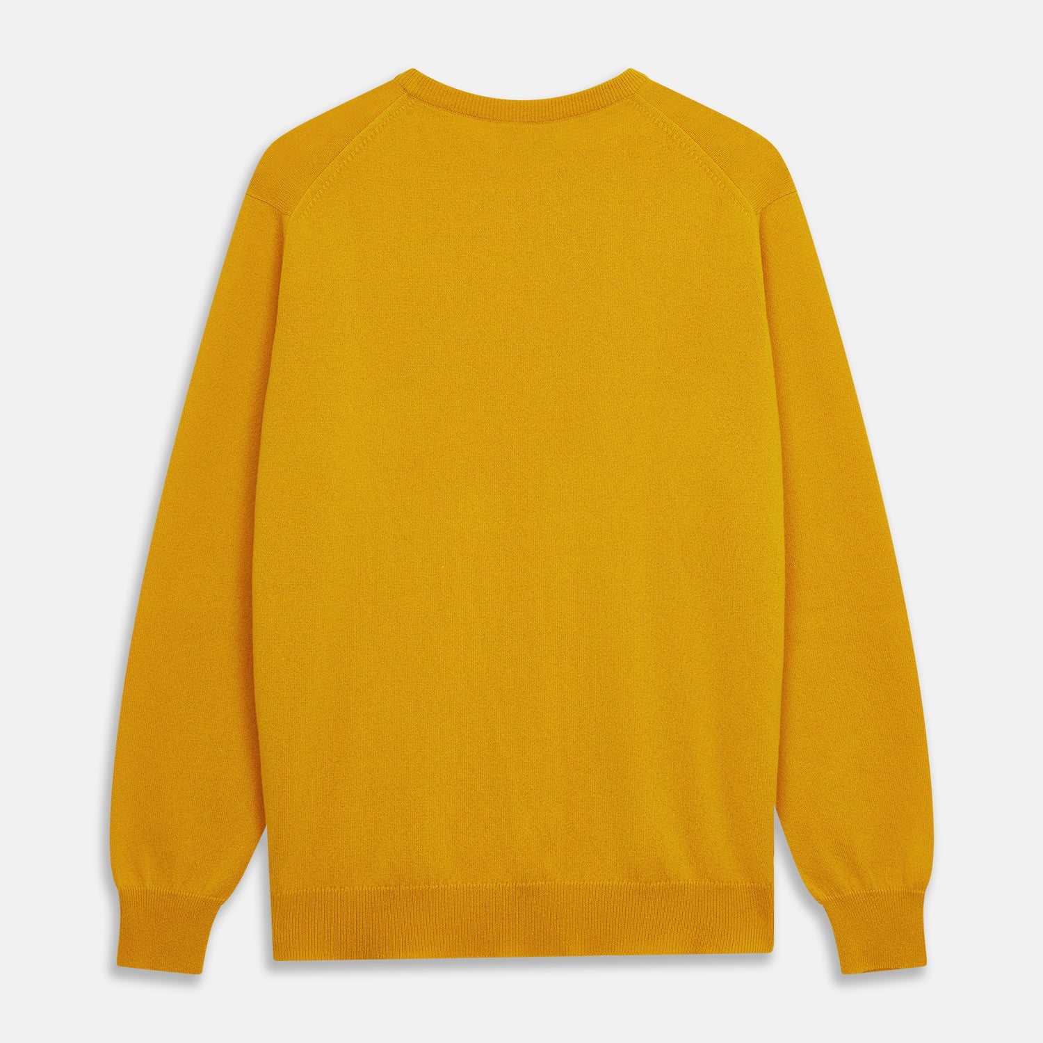View 3 of product The Gold Glenn Cashmere Crew Neck Jumper by Turnbull & Asser is a luxurious, long-sleeved knit in vibrant mustard yellow, shown laid flat on a white background—an eye-catching essential.