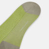 View 3 of product The Turnbull & Asser Lime/grey Thin Striped Long Socks are knee-high with green and yellow stripes and solid tan toe, heel, and cuff, shown against a plain light background.