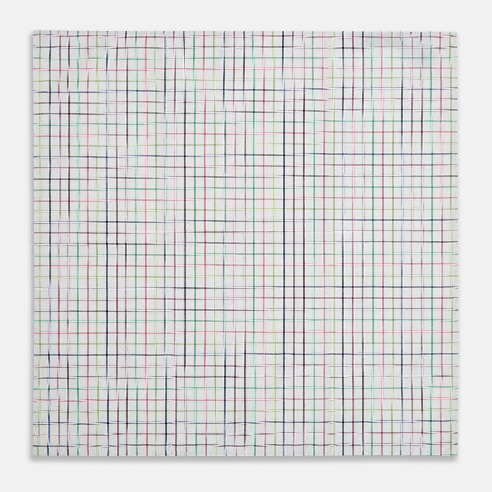 The Turnbull & Asser Green Multi Double Grid Check Hand-Rolled Handkerchief features a white base with thin blue, pink, and green lines forming small squares, finished with elegant hand-rolled edges.