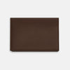 View 3 of product The Dark Brown Leather Bi-Fold Card Holder by Turnbull & Asser features neat edge stitching and the brand's name embossed in white on the front.
