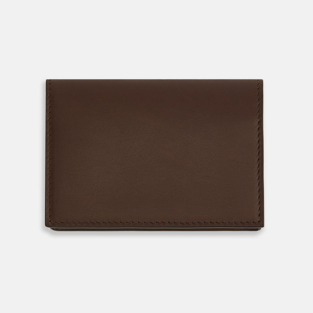 The Dark Brown Leather Bi-Fold Card Holder by Turnbull & Asser features neat edge stitching and the brand's name embossed in white on the front.
