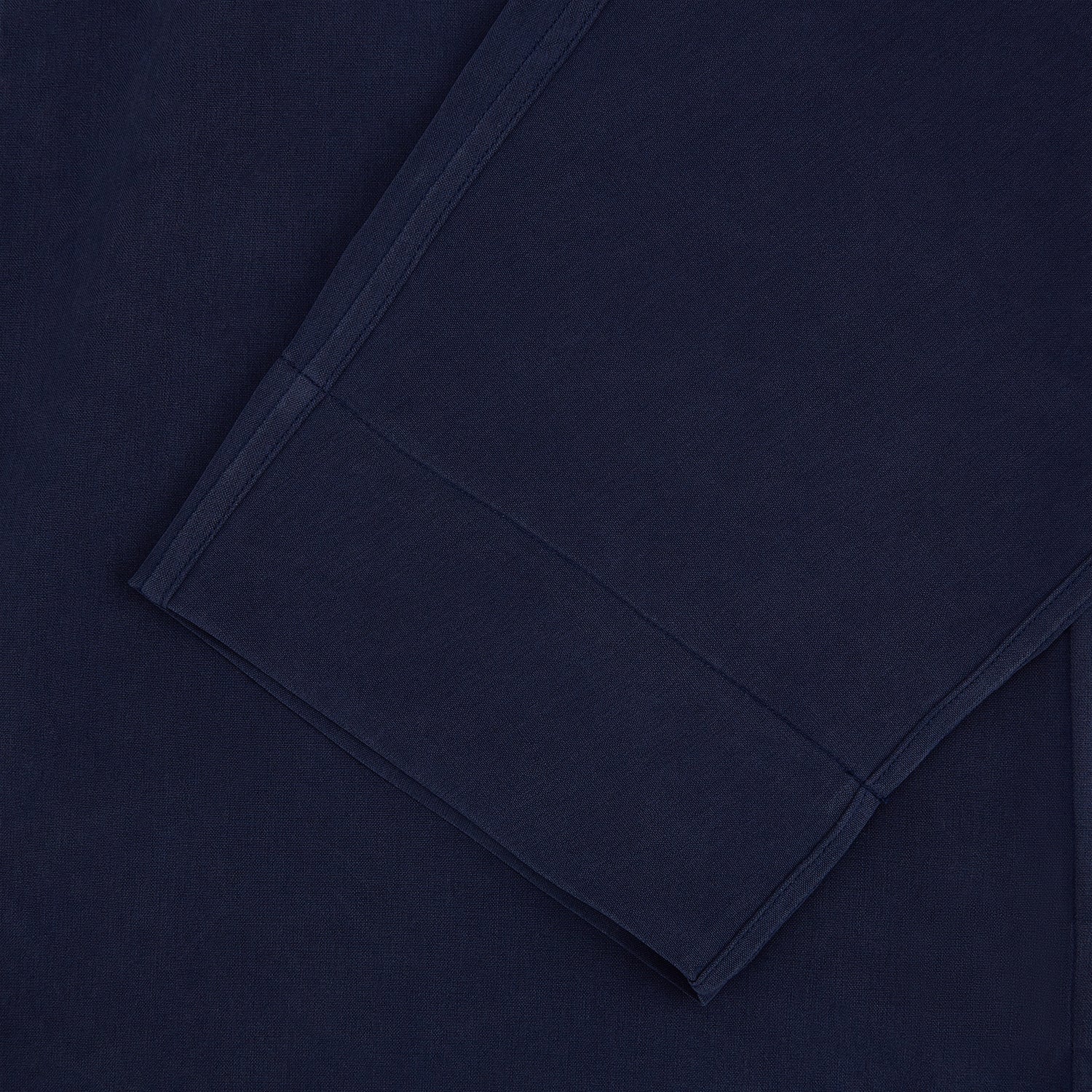 View 3 of product Turnbull & Asser Navy Silk Pyjama Set, laid flat on a white background, includes a long-sleeve button-up shirt with chest pocket and drawstring pants.
