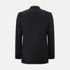 View 5 of product The Turnbull & Asser Black Single Breasted Dinner Suit features fine wool, a satin shawl collar jacket, and matching trousers—perfect formal wear, shown on a plain white background.