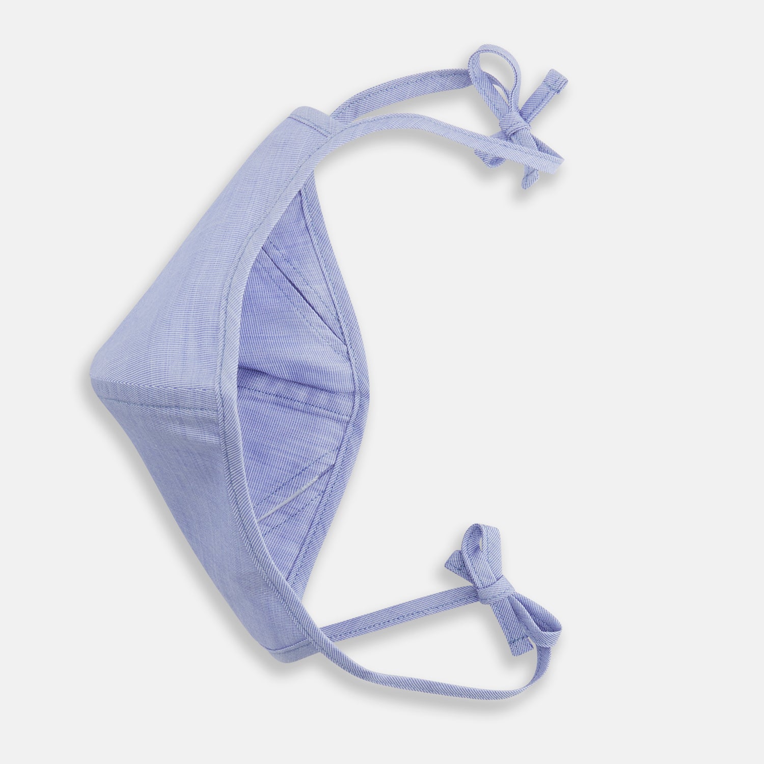 View 3 of product The Turnbull & Asser Plain Pale Blue Commuter Mask with 3 Viroformula™ filters features adjustable ear loops and side ties—ideal for daily use, shown against a white background.