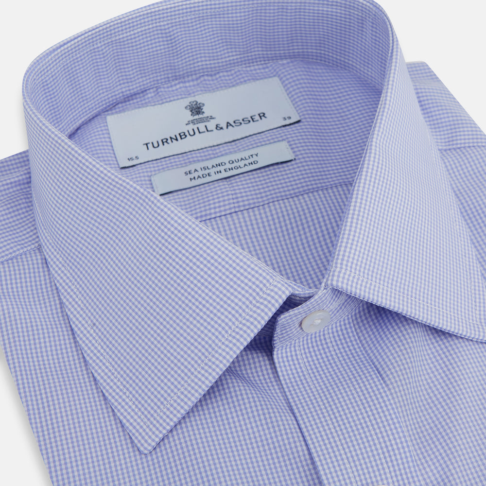 The Turnbull & Asser Blue Fine Check Sea Island Quality Cotton Shirt features a T&A collar, 3-button cuffs, and white buttons, shown on a plain white background.