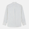 View 6 of product A man with short brown hair stands against a beige background in a Turnbull & Asser Blue and Off-White Stripe Cotton Weekend Fit Finch Shirt, featuring vertical stripes and a Derby collar, paired with dark pants. One hand is in his pocket; he has a neutral expression.