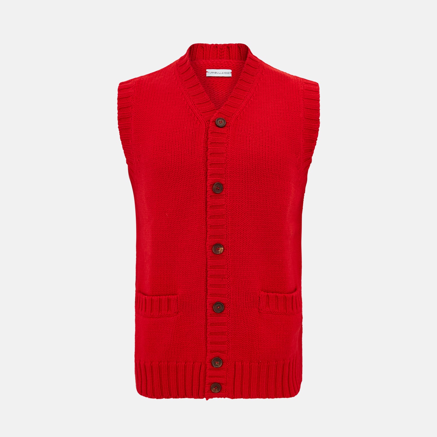 View 1 of product The Turnbull & Asser Red Merino V-Neck Sleeveless Cardigan features a ribbed collar, button front, and two front pockets—a refined lightweight layer—shown against a plain white background.