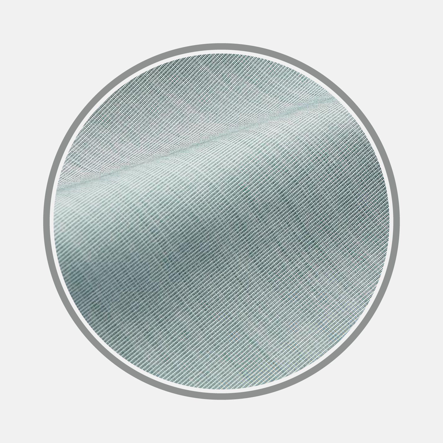 View 1 of product Close-up view of Plain Green Cotton Fabric by Turnbull & Asser, highlighting fine diagonal weave and texture, framed within a circular border on a white background.