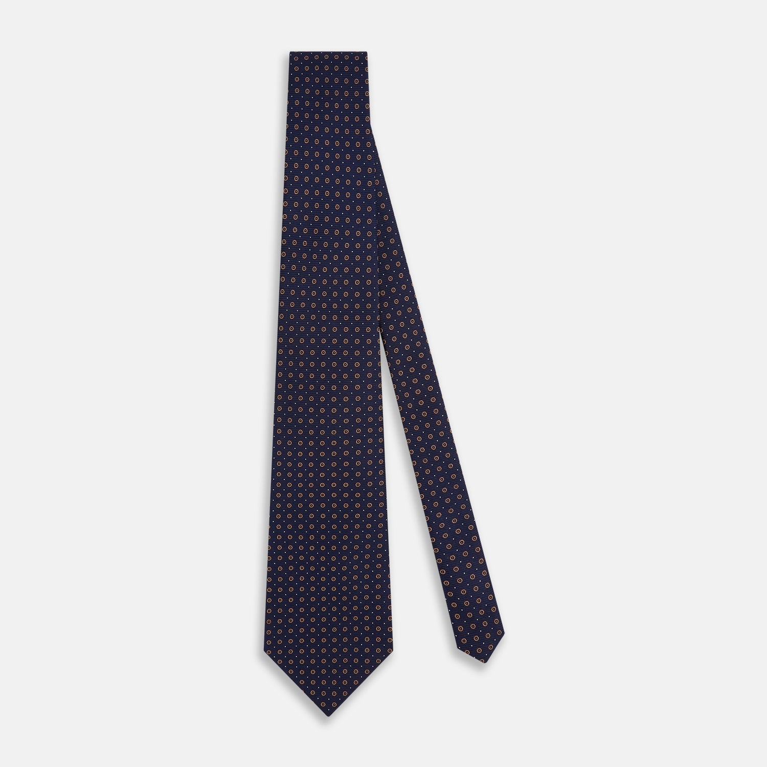 View 2 of product The Turnbull & Asser Navy and Brown Circle Silk Tie features an elegant pattern, perfect for adding a refined touch to your modern office attire.