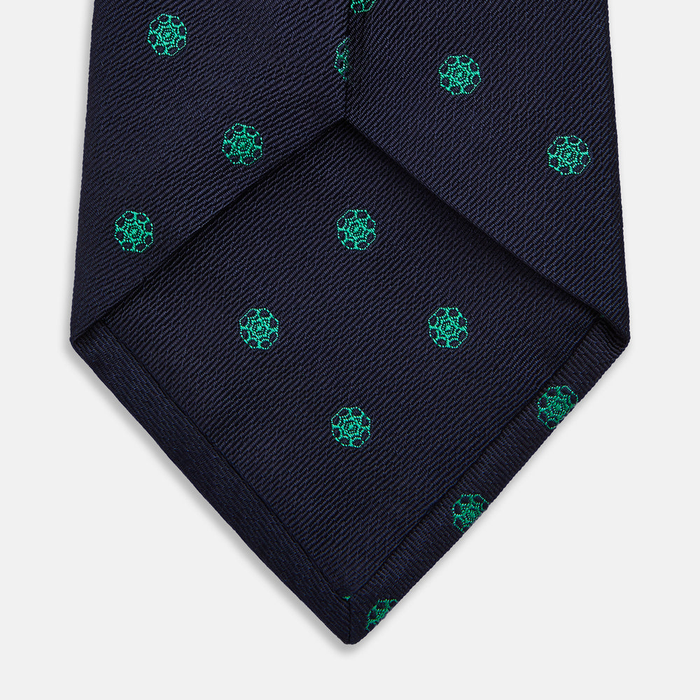 The Green flower and navy silk tie by Turnbull & Asser is perfect for adding a touch of color to any classic wardrobe.