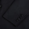 View 7 of product The Turnbull & Asser Black Single Breasted Dinner Suit features fine wool, a satin shawl collar jacket, and matching trousers—perfect formal wear, shown on a plain white background.