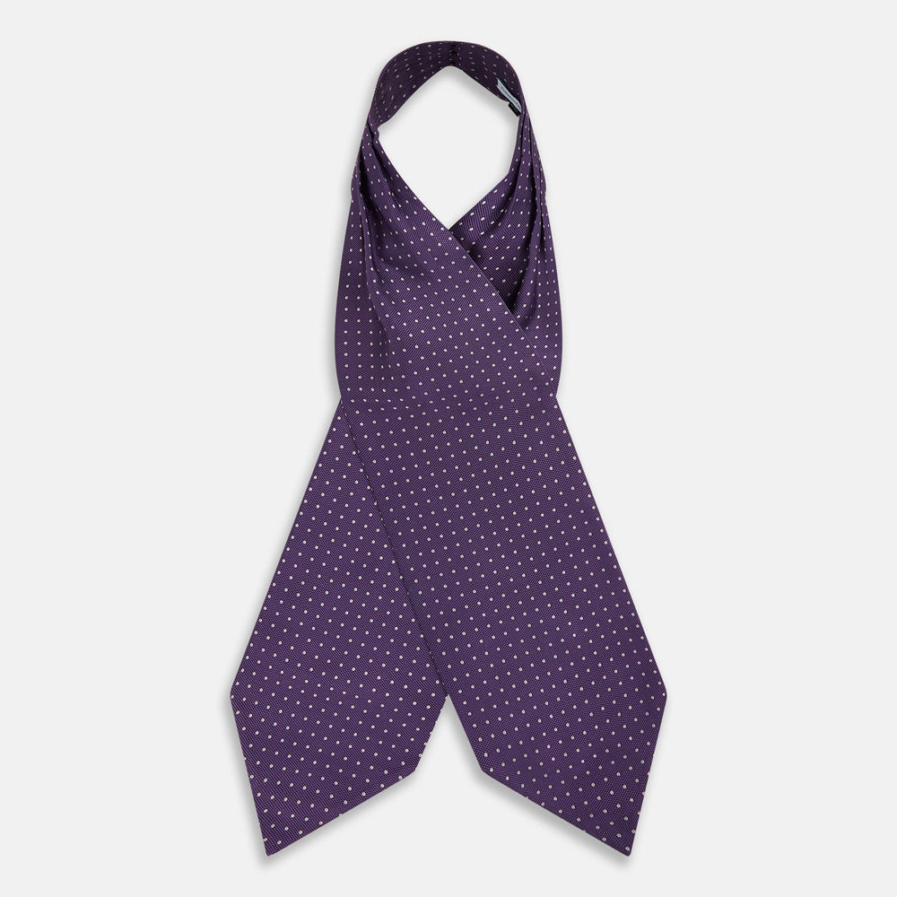 The Lilac and Purple Micro Dot Silk Cravat by Turnbull & Asser features evenly spaced white dots—offering an elegant, handmade accent to your formal ensemble or pocket square collection.