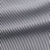 View 2 of product The Turnbull & Asser Black Candy Stripe Cotton Hyde Pyjama Set for men features soft cotton striped pajamas with a long-sleeve, button-up shirt detailed with black piping and three pockets, plus matching pants, both laid flat on a white background.