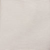 View 3 of product The Turnbull & Asser HORIZONTAL TWILL VELLUM TIE, a light beige silk necktie with a subtle ribbed texture, is shown rolled up on a white background—an essential finishing touch for smart attire.