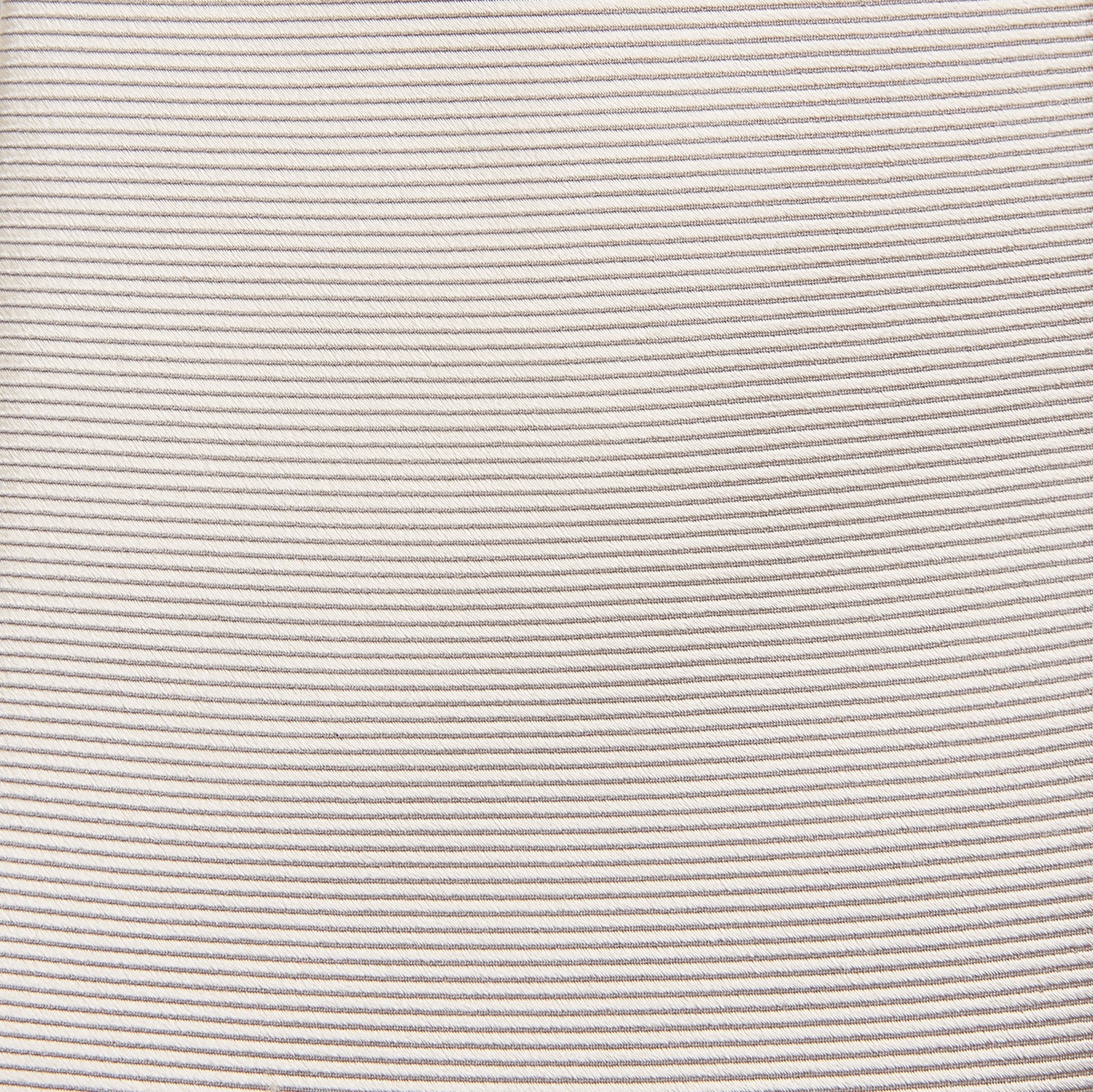 View 3 of product The Turnbull & Asser HORIZONTAL TWILL VELLUM TIE, a light beige silk necktie with a subtle ribbed texture, is shown rolled up on a white background—an essential finishing touch for smart attire.