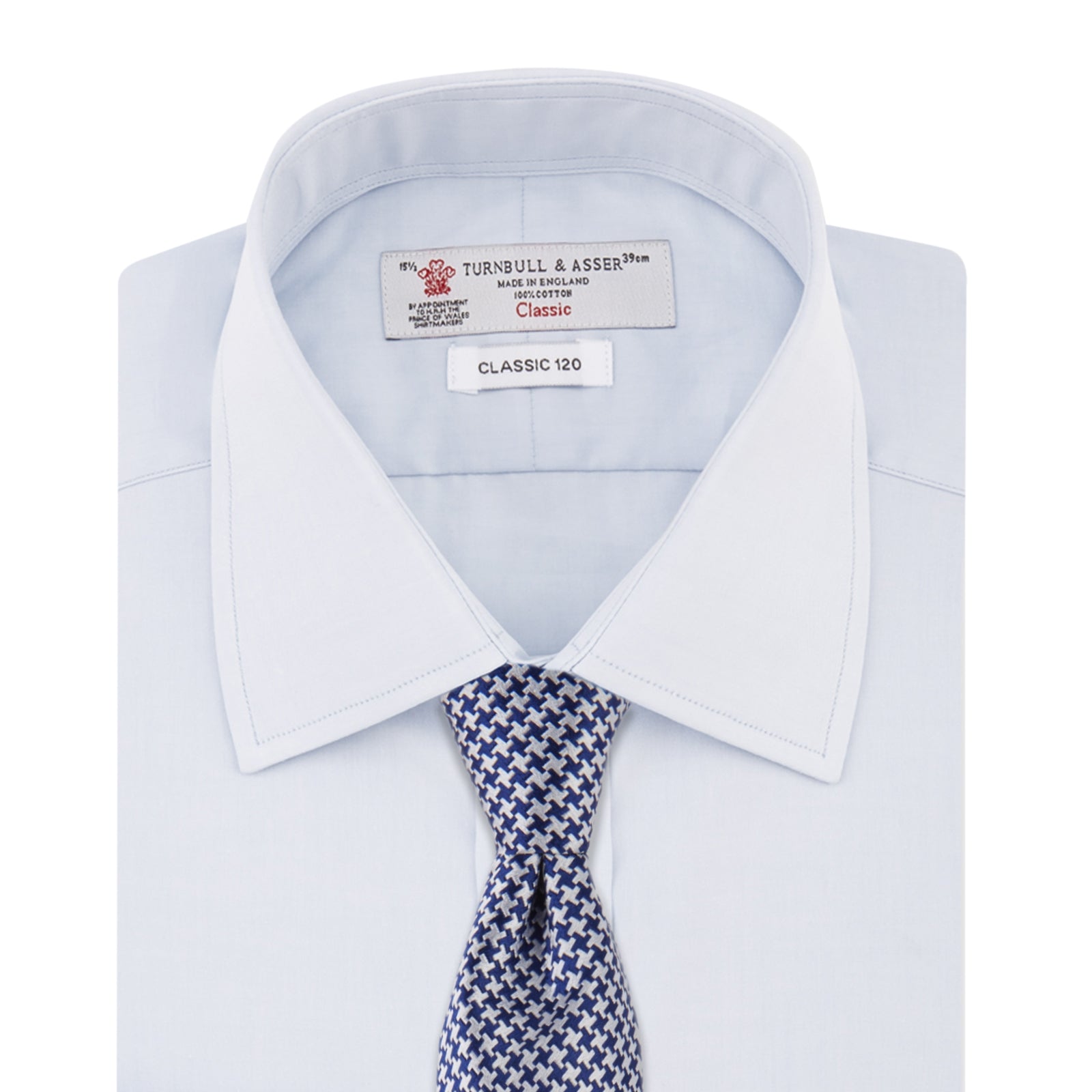 View 4 of product The Turnbull & Asser Two-Fold 120 Light Blue Shirt features a T&A collar, 3-button cuffs, white buttons, front pocket, and inner collar label. It is displayed neatly folded on a plain white background.
