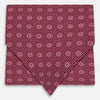 View 1 of product The Burgundy Medallion Silk Cravat by Turnbull & Asser features a white geometric medallion pattern, neatly crafted for an elegant accessory inspired by classic British style.
