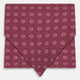 The Burgundy Medallion Silk Cravat by Turnbull & Asser features a white geometric medallion pattern, neatly crafted for an elegant accessory inspired by classic British style.