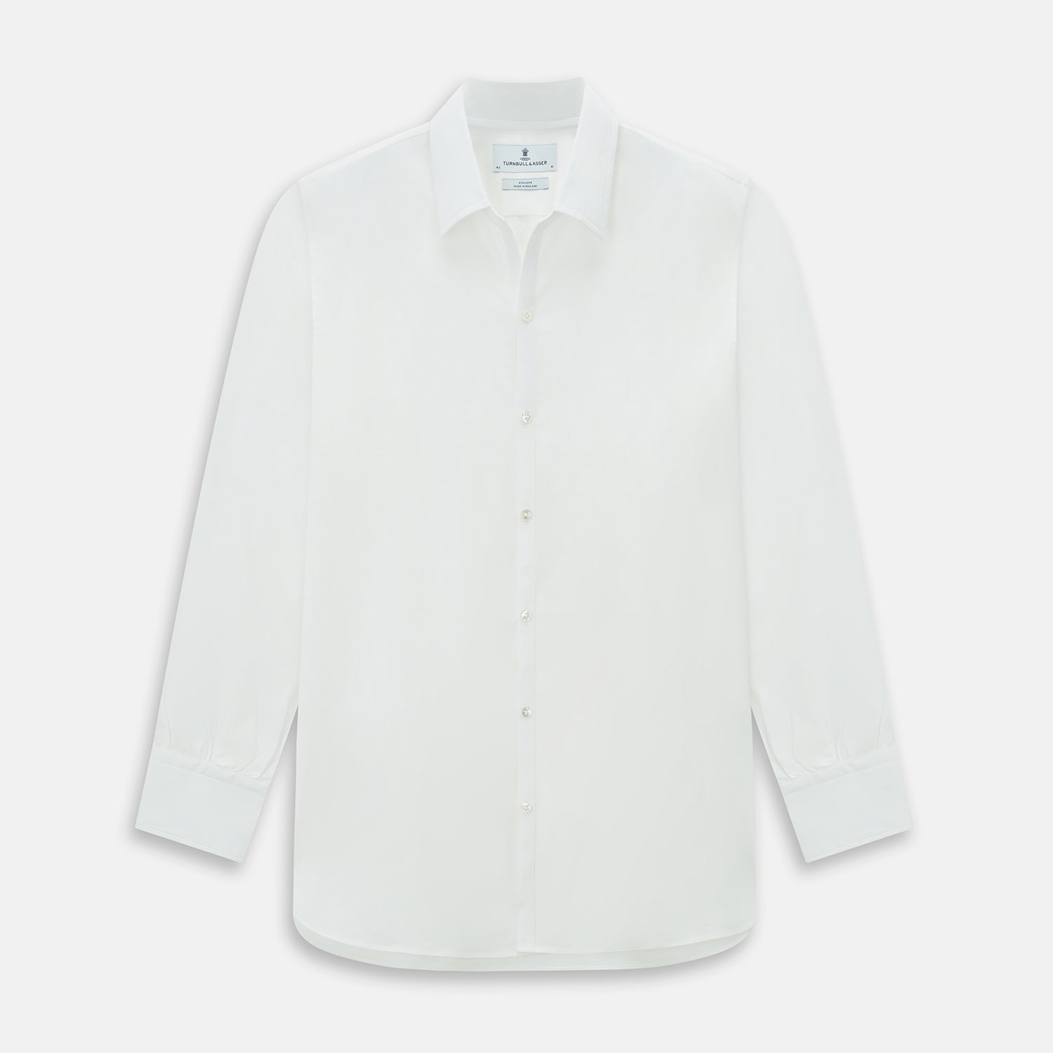 View 1 of product The Turnbull & Asser Plain White Windsor Shirt features a Turnbull open collar, 3-button cuffs, and relaxed fit—exemplifying British craftsmanship. Displayed on a white background.