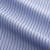View 2 of product The Blue and Navy Halo Stripe Cotton Sussex Nightshirt by Turnbull & Asser features long sleeves, a collar, button-down front, chest pocket, curved hem, and brown piping for a classic luxury sleepwear style.