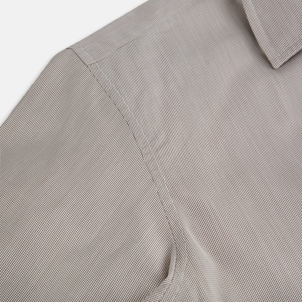 The Turnbull & Asser Brown Micro Graph Check Westminster shirt features long sleeves, a pointed collar, and buttoned cuffs—showcasing British craftsmanship and displayed flat on a white background.