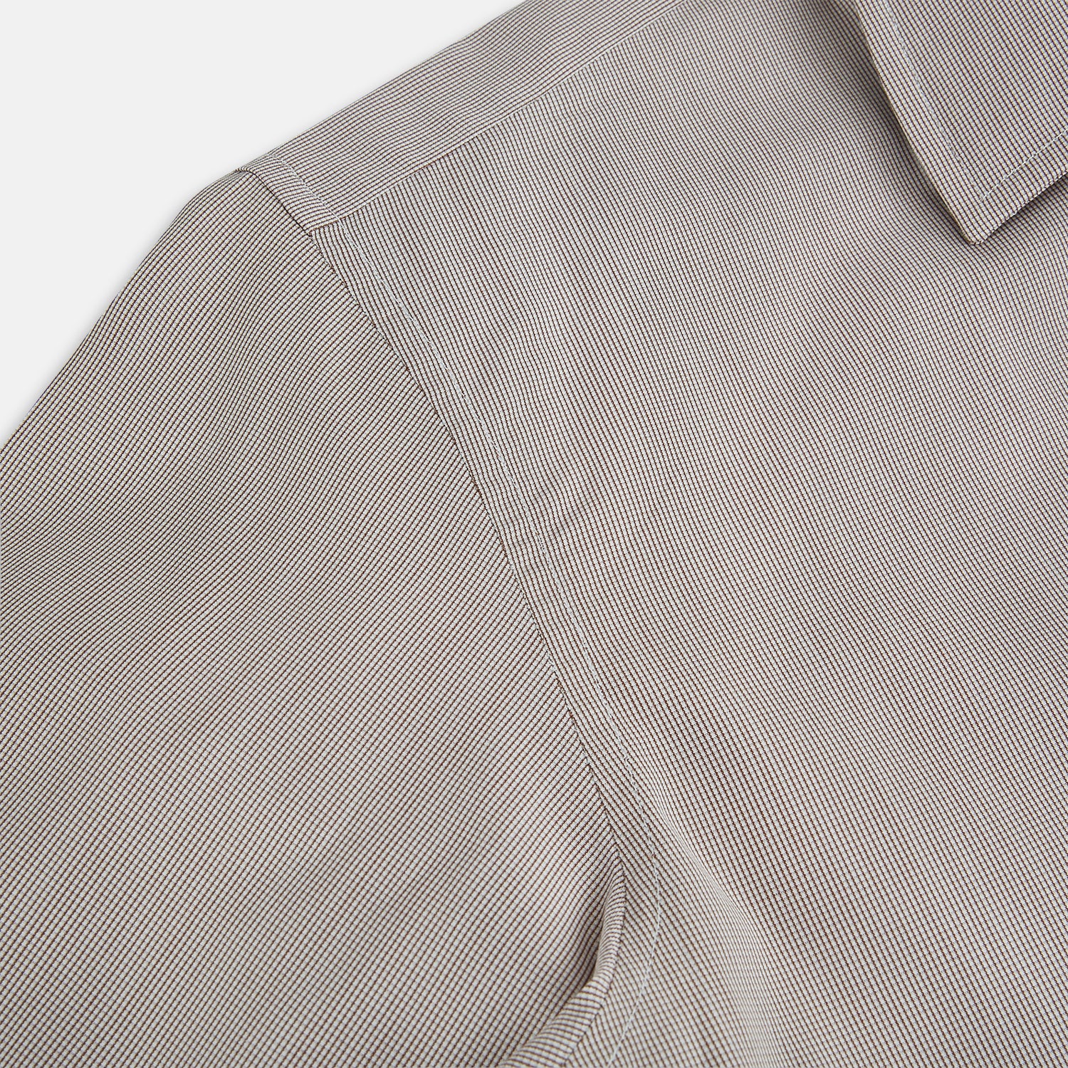 View 6 of product The Turnbull & Asser Brown Micro Graph Check Westminster shirt features long sleeves, a pointed collar, and buttoned cuffs—showcasing British craftsmanship and displayed flat on a white background.