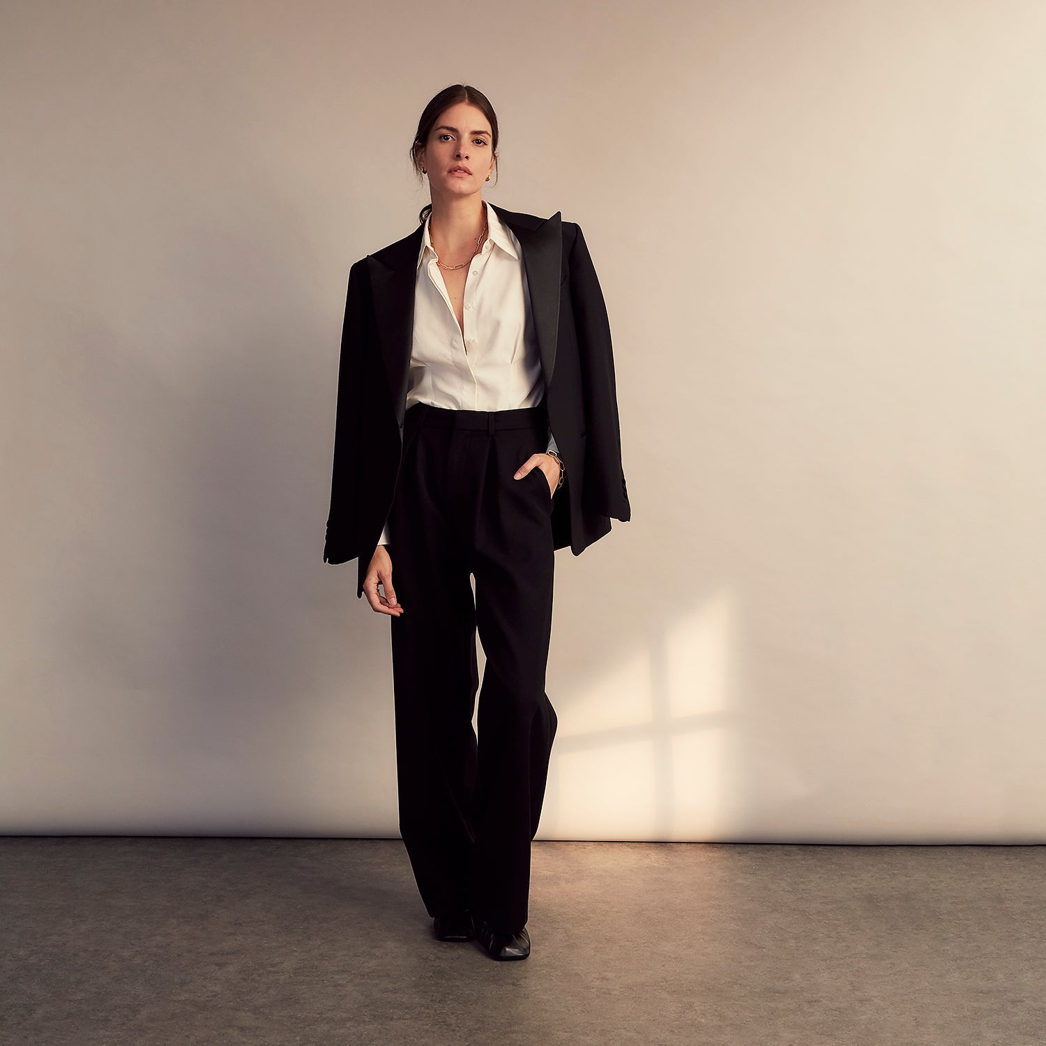 View 11 of product The Cream Silk Tailored Bianca Shirt by Turnbull & Asser features long sleeves, a pointed collar, and curved hem in soft-touch peace silk with a tailored fit. Shown laid flat on a white background.